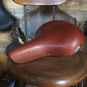 Delivered: Phantom saddle restored as original with correct paint, plating, and correct leather, not glued.